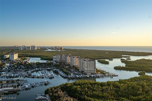 aerial view at dusk with a water view