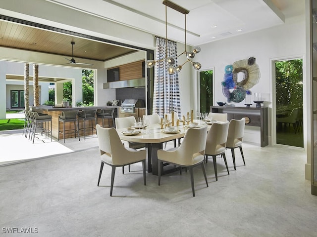 dining room featuring a notable chandelier and wooden ceiling