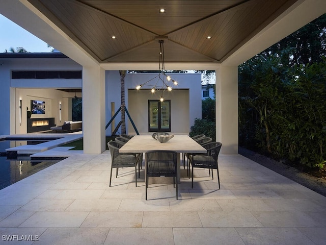 view of patio with an outdoor fireplace