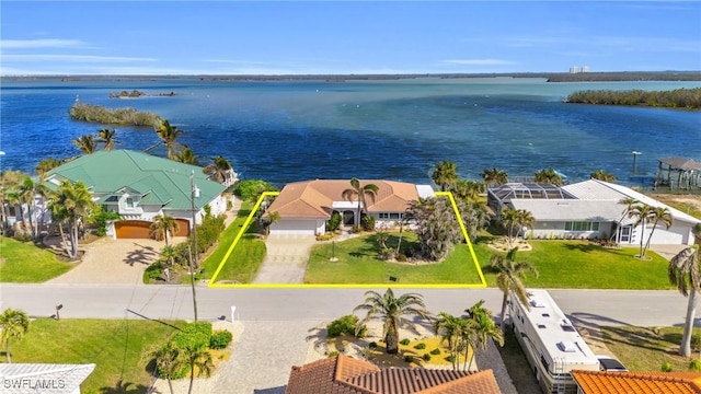 birds eye view of property featuring a water view