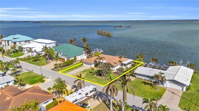 birds eye view of property featuring a water view