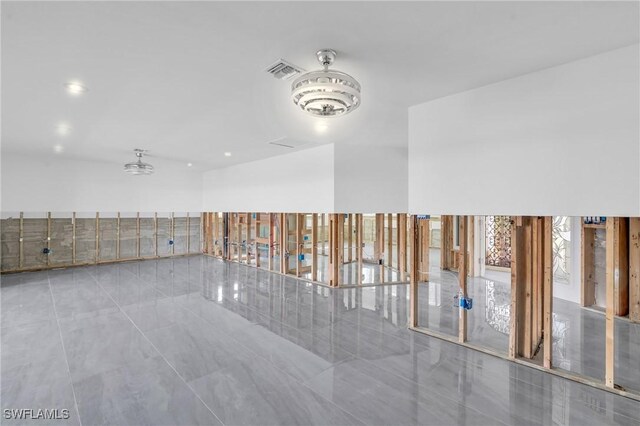 spare room featuring light tile patterned flooring