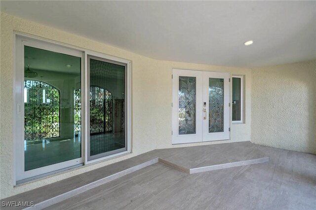 entrance to property with french doors and a patio