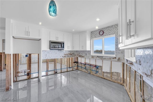 kitchen featuring white cabinetry