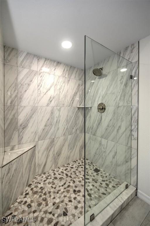 bathroom with a tile shower