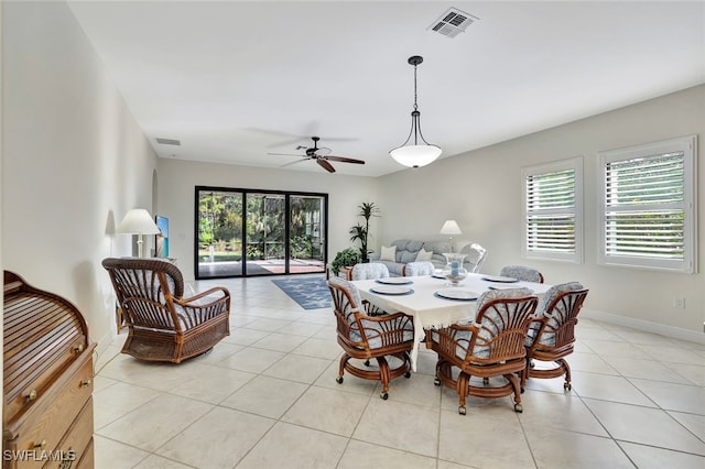 tiled dining room with ceiling fan