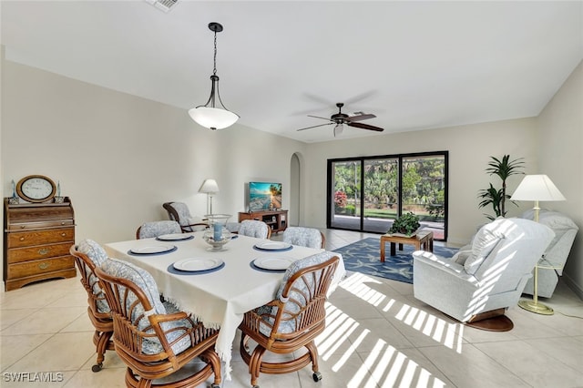 dining area featuring ceiling fan and light tile patterned floors