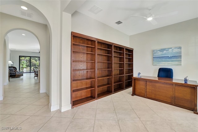 tiled office space with ceiling fan