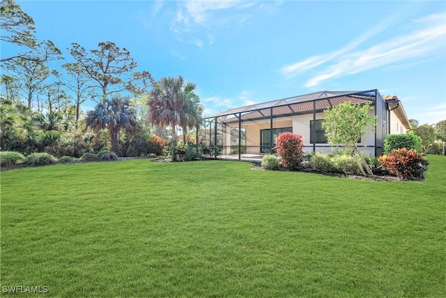 view of yard featuring glass enclosure