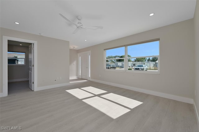 unfurnished bedroom with recessed lighting, baseboards, multiple windows, and light wood finished floors