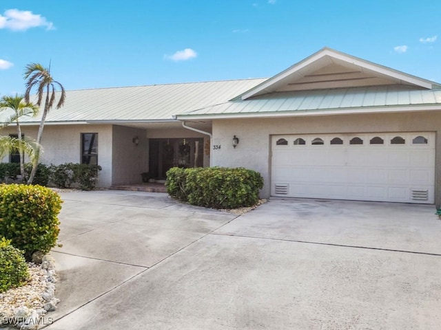 single story home featuring a garage