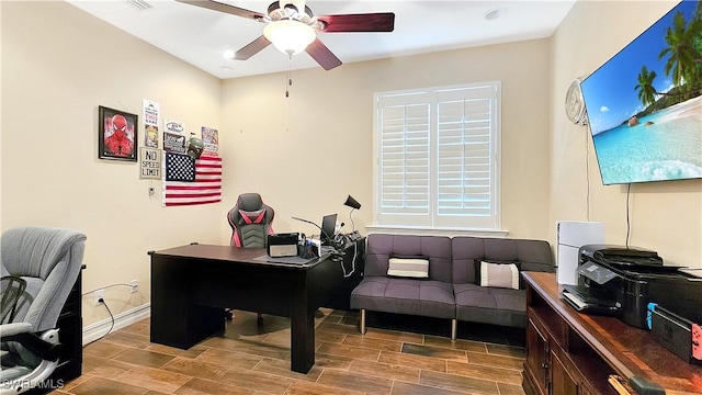 office with ceiling fan, wood tiled floor, and baseboards