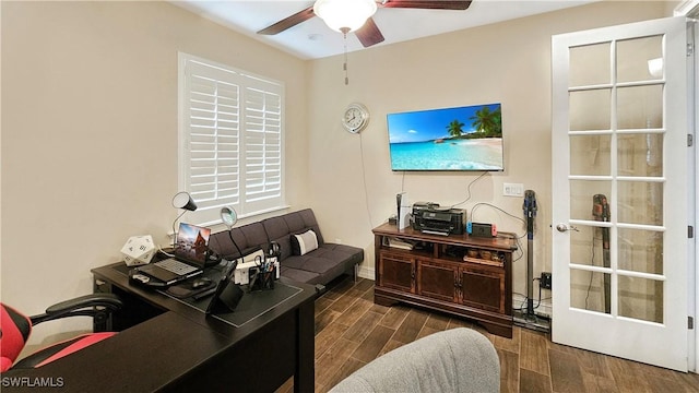 office area featuring a ceiling fan, wood tiled floor, and baseboards