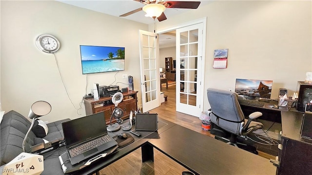 office with a ceiling fan, french doors, and wood finished floors