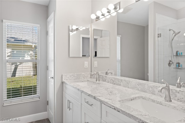 bathroom featuring vanity and walk in shower