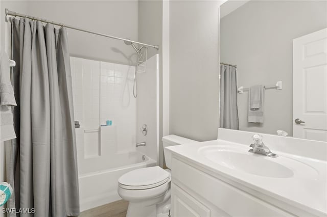 full bathroom featuring wood-type flooring, vanity, shower / bath combination with curtain, and toilet