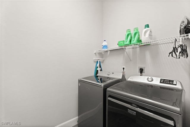 laundry room featuring washing machine and dryer