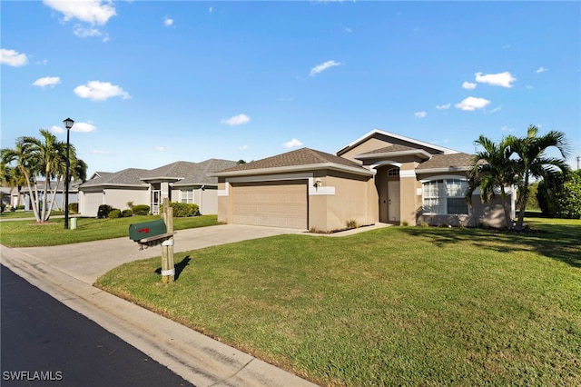 view of front of house with a front yard and a garage