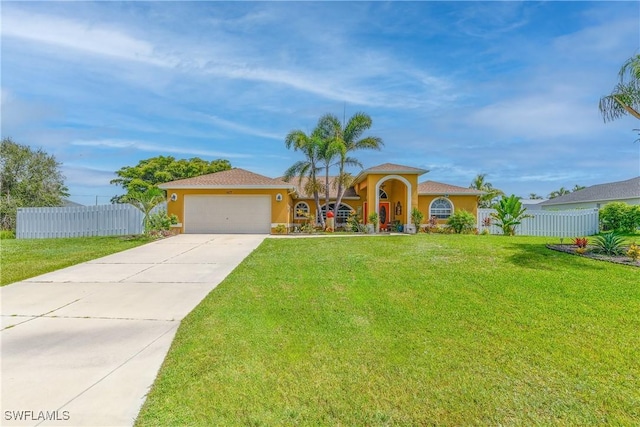 view of front of home featuring a front lawn and a garage