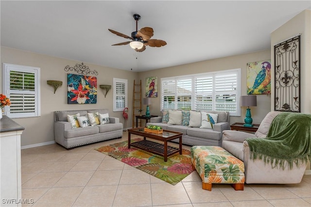 living room with ceiling fan and light tile patterned flooring