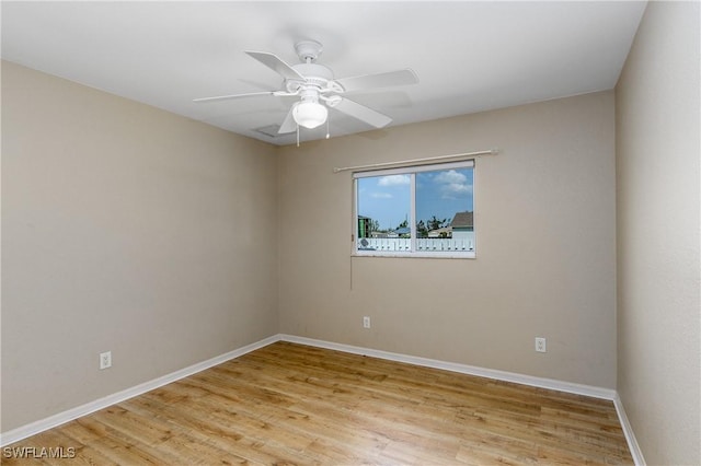 spare room with ceiling fan and light hardwood / wood-style flooring