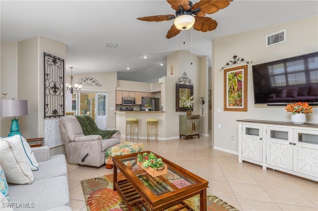 tiled living room featuring ceiling fan with notable chandelier and lofted ceiling