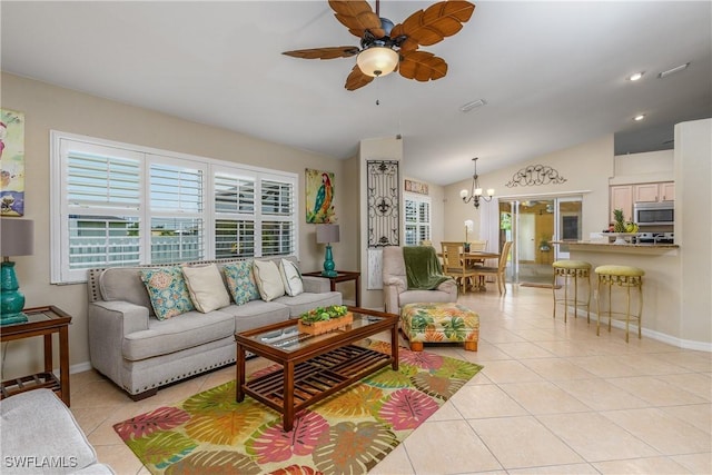 1427 SW 2nd St, Cape Coral, FL 33991 - living room with vaulted ceiling, ceiling fan, light tile patterned floors, and a chandelier