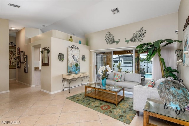 1427 SW 2nd St, Cape Coral, FL 33991 - living area featuring tile patterned floors and vaulted ceiling