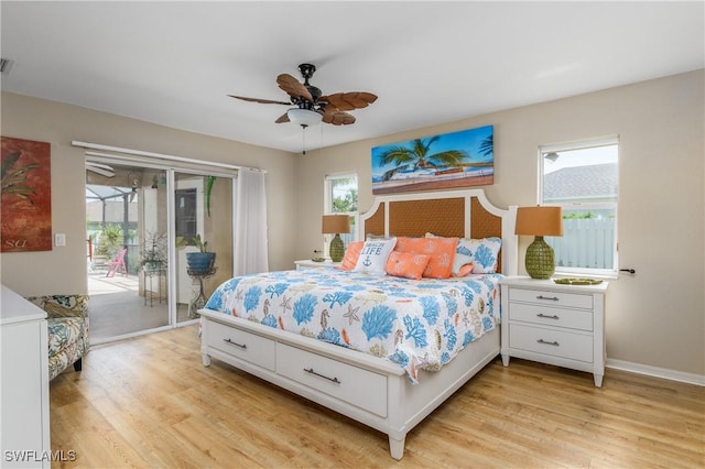 1427 SW 2nd St, Cape Coral, FL 33991 - bedroom featuring access to outside, multiple windows, and light wood-style floors
