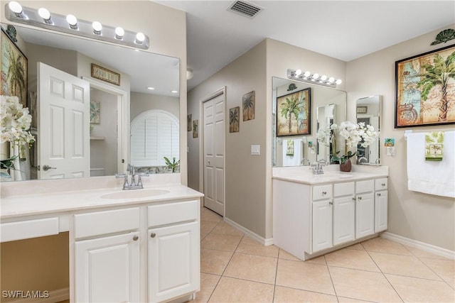 1427 SW 2nd St, Cape Coral, FL 33991 - bathroom featuring two vanities and tile patterned flooring