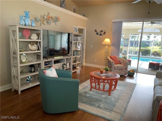 living room with dark hardwood / wood-style floors and ceiling fan