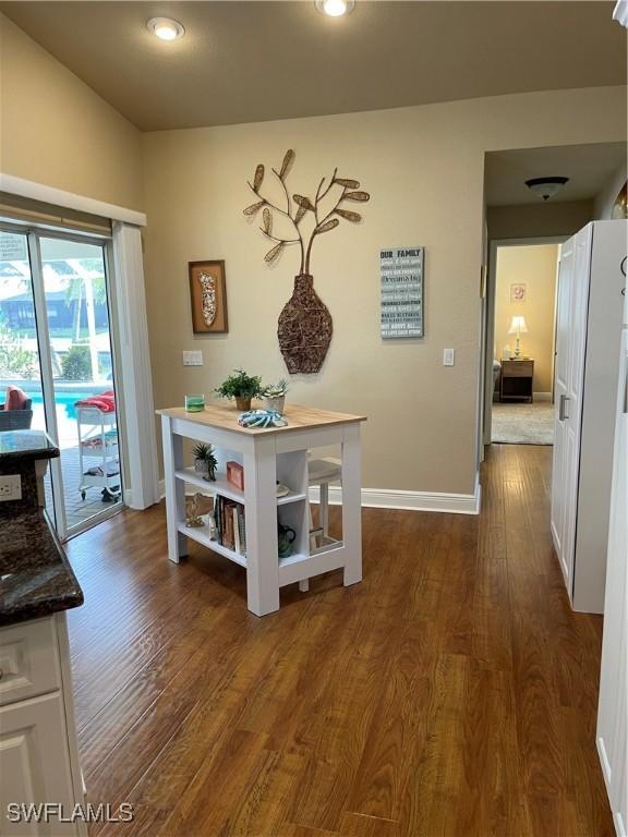 hall featuring dark wood-type flooring