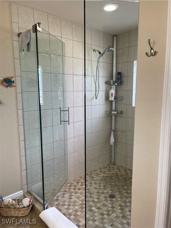 bathroom featuring an enclosed shower