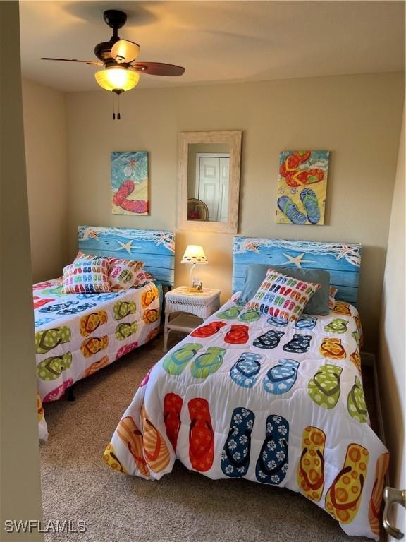 carpeted bedroom with ceiling fan