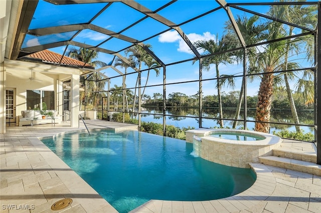 view of pool featuring an in ground hot tub, a lanai, ceiling fan, a water view, and a patio area