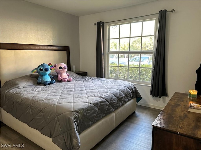 bedroom featuring dark hardwood / wood-style floors