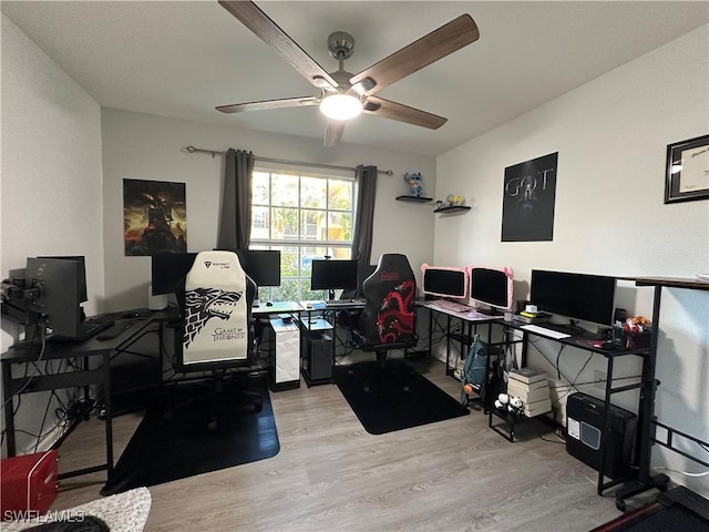 office space with light wood-type flooring and ceiling fan