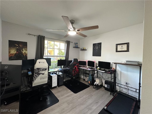 office with ceiling fan and light hardwood / wood-style floors