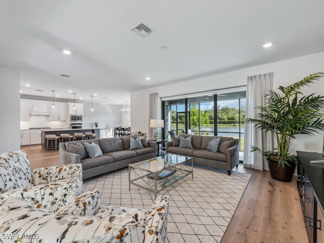 living room with light hardwood / wood-style floors