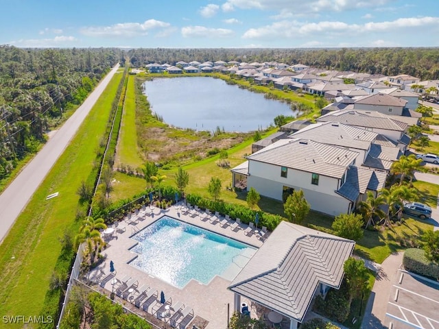 birds eye view of property with a water view