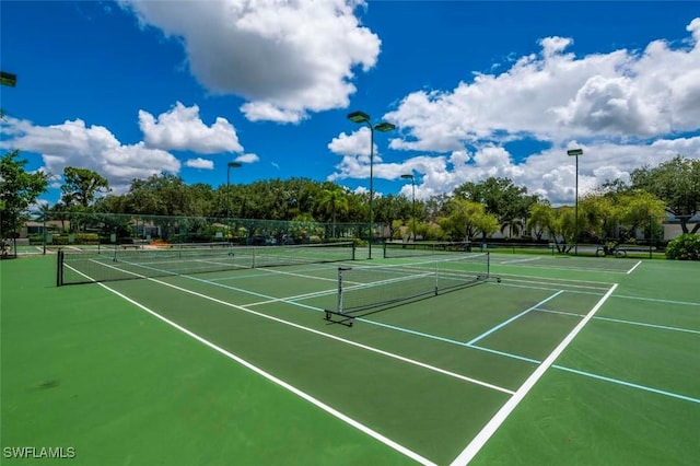 view of sport court with fence