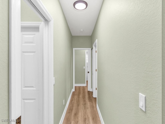 hallway featuring light hardwood / wood-style floors