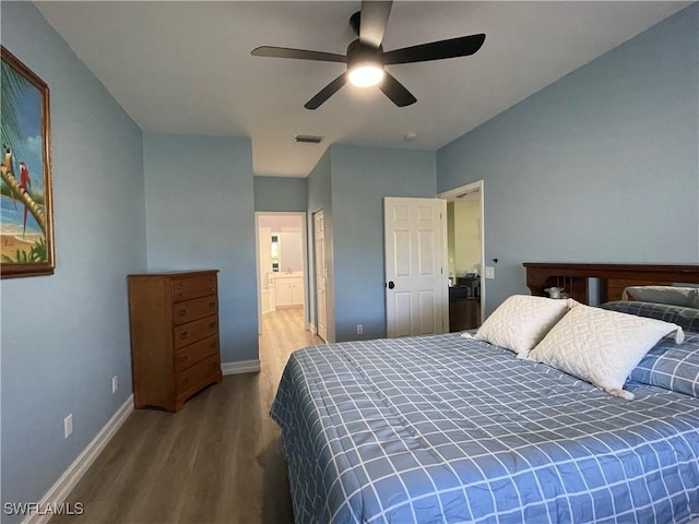 bedroom with ceiling fan, wood-type flooring, and connected bathroom