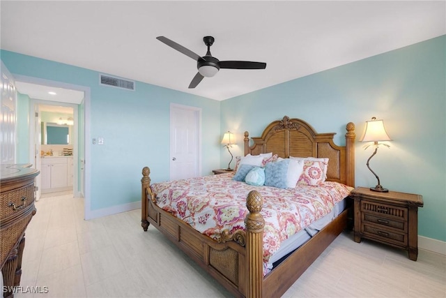 bedroom featuring ensuite bath and ceiling fan