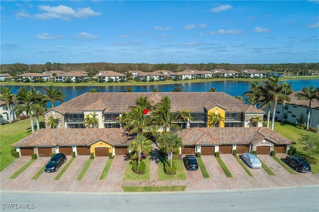 bird's eye view featuring a water view and a residential view