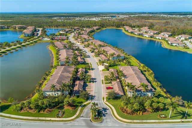 bird's eye view featuring a residential view and a water view