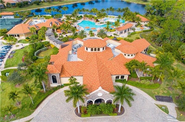 birds eye view of property with a water view