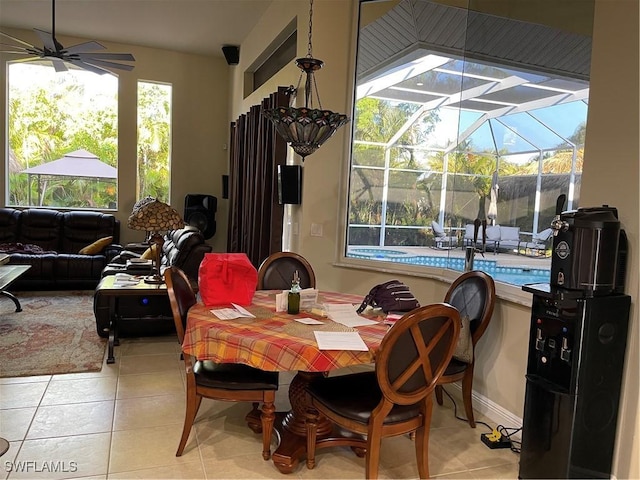 tiled dining room with ceiling fan