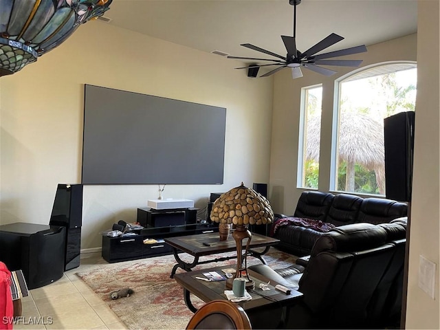 living room with ceiling fan and light tile patterned floors