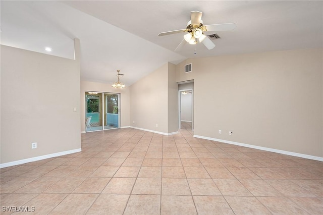 tiled empty room with ceiling fan with notable chandelier and vaulted ceiling